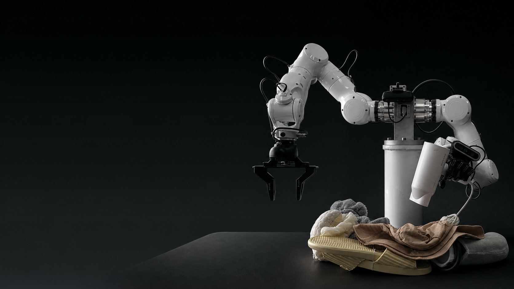 A dual-arm robot grasping clothes from a pile